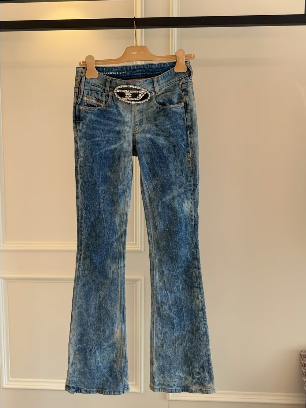 Diesel blue washed flare jeans with rhinestone buckle